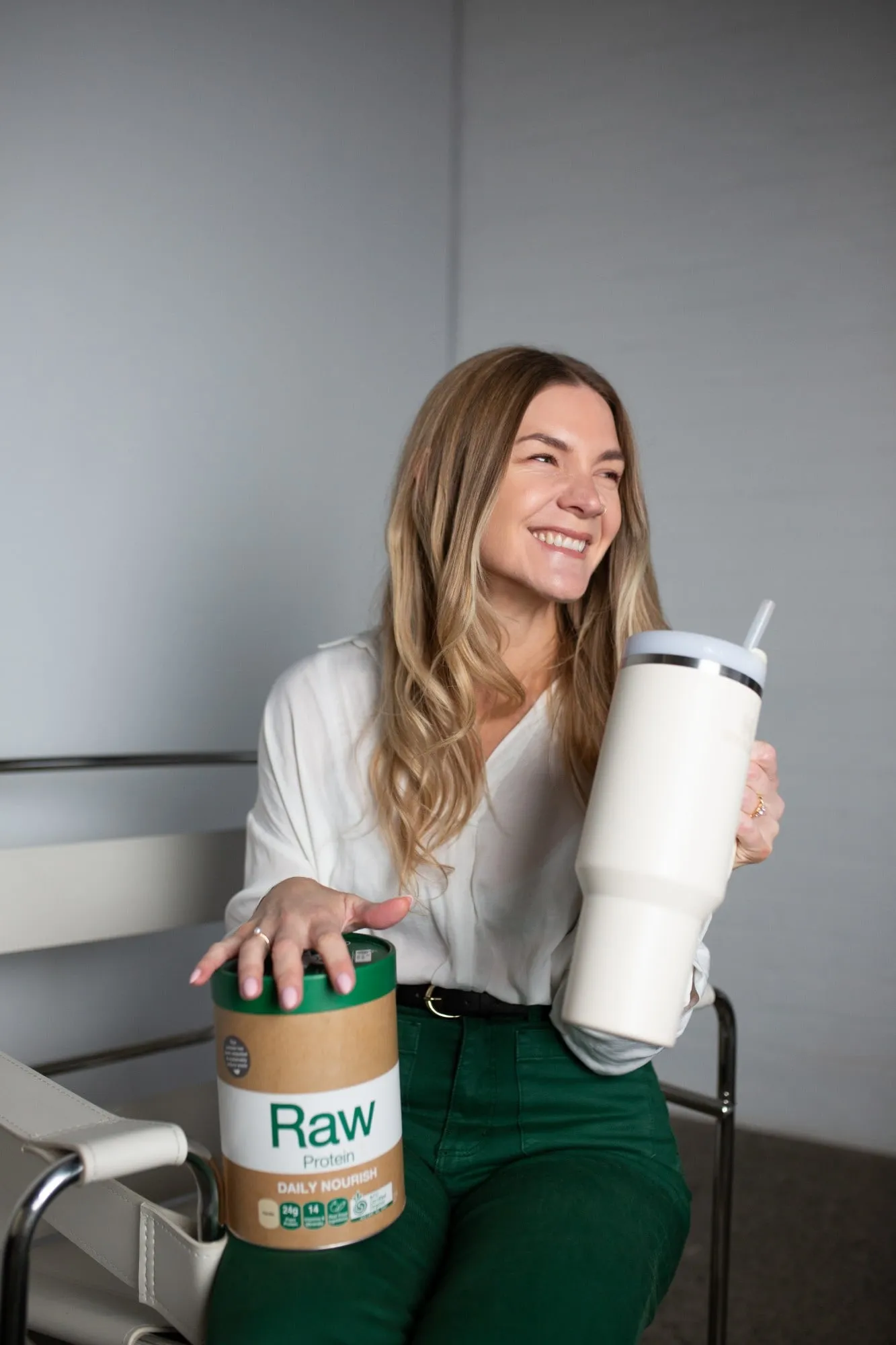 Natalie with protein powder and a water bottle